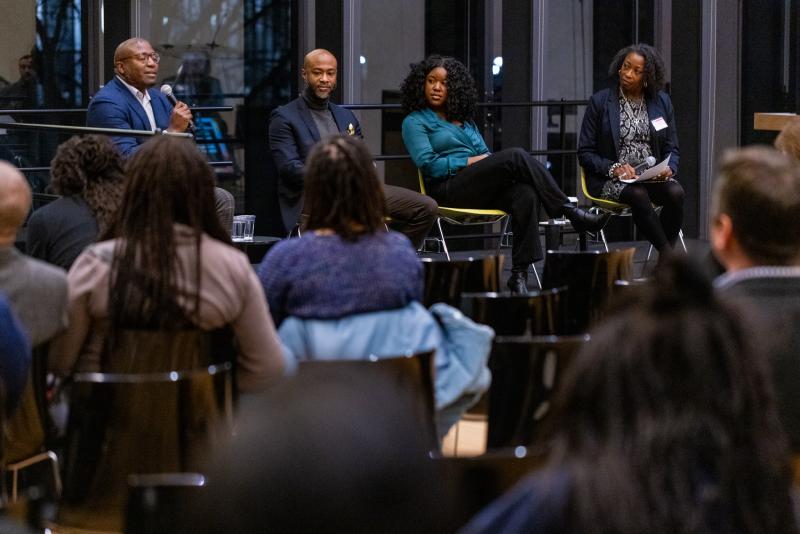 A group of panelists on stage