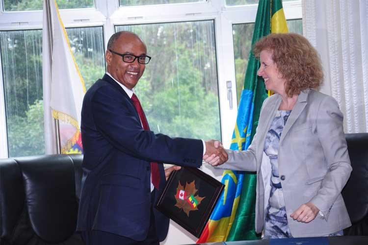 Regehr and Woldehanna shake hands after signing an MOU between the two universities (photo courtesy of Marci Rose)