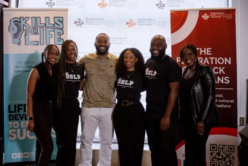 A group of people posing for a photo at an event