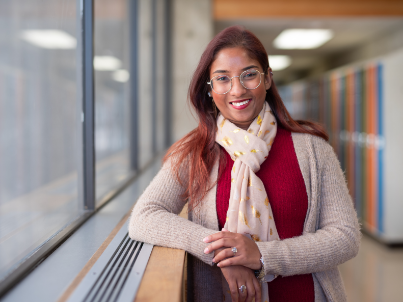 Portrait of Rashmi de Silva Wijeyeratne standing in a hallway