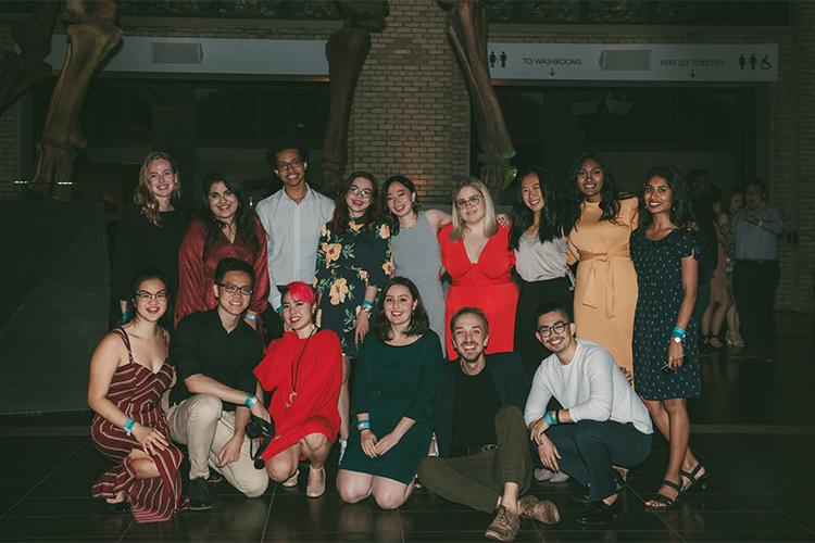 A group young men and women smile and pose together at New College Orientation in 2019.