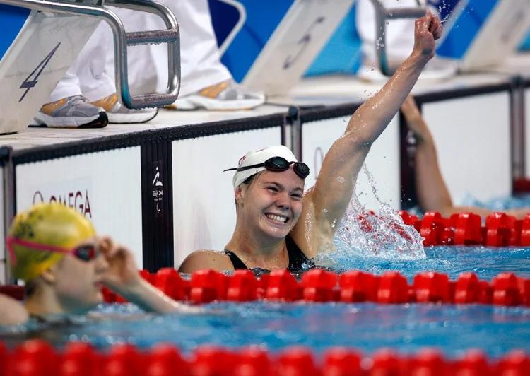 Stephanie celebrating after winning a swim race