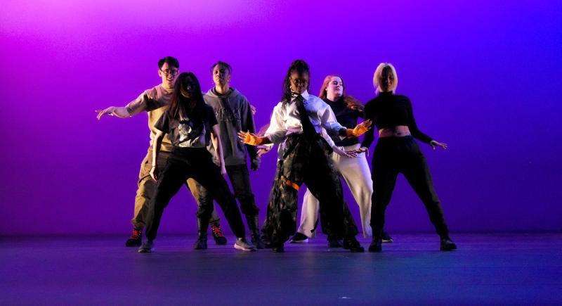Students on stage at Hart House Theatre perform a dance routine