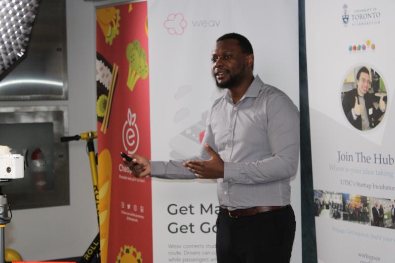 Chijindu Ukagwu gestures while explaining his startup chatbot mhapy.