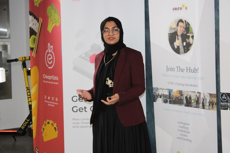 Aliya Ali Shaikha gestures as she explains her startup Meds for Less.