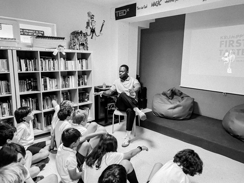 Michael reading to a room of children