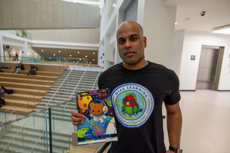 A man holding up a book