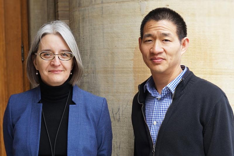 In a picture taken before the COVID-19 pandemic, Lisa Austin and Davie Lie stand together in a hallway.