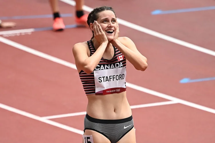 Lucia Stafford reacts after winning a race