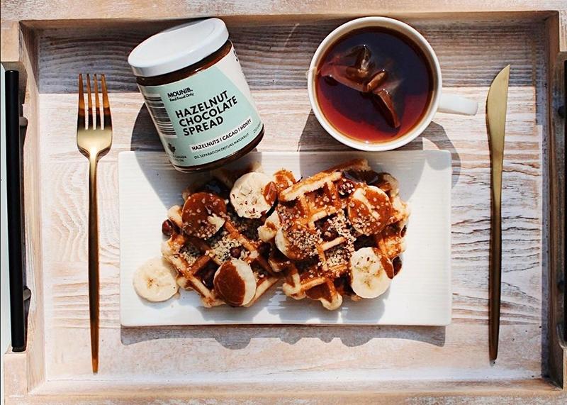 A tray with waffles and chocolate spread