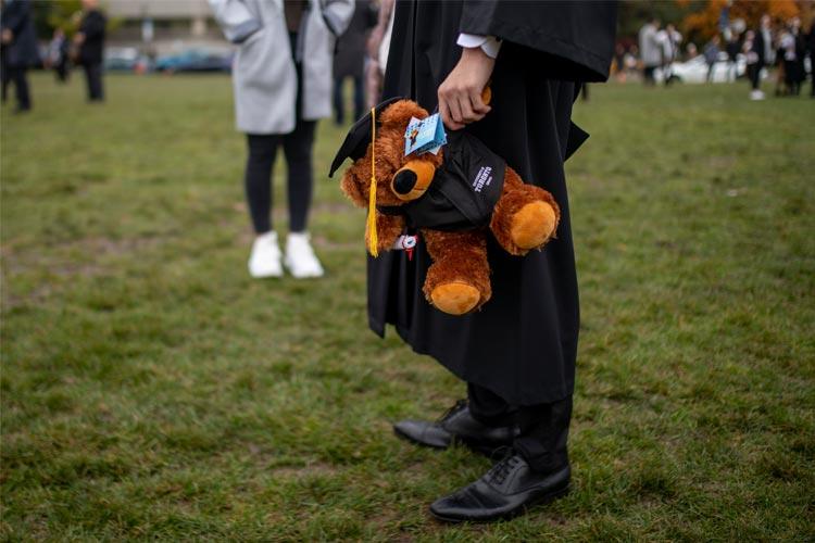 A U of T grad holds his new fuzzy friend on Front Campus (photo by Nick Iwanyshyn) 