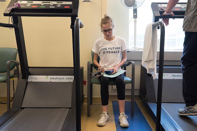 Elspeth Arbow, an undergraduate student with cystic fibrosis recovering from her second double-lung transplant, gets ready for physiotherapy at Toronto General Hospital on May 4 (photo by Geoffrey Vendeville)