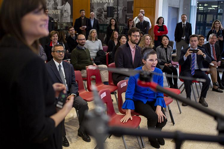 Kirsty Duncan, minister of science and sport, watches a demonstration during a Nov. 13  announcement about new and renewed chairs in the Canada Research Chairs program, including 21 at U of T  (photo by Nick Iwanyshyn)