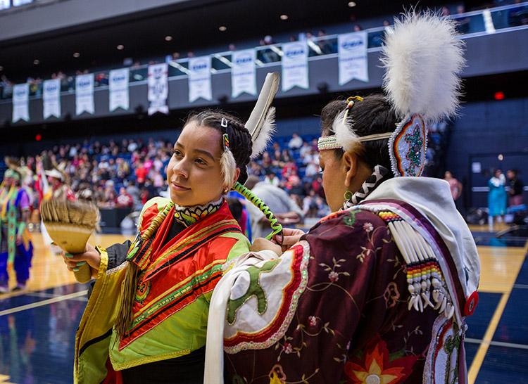 Hundreds of people in a rainbow of colours filled the Goldring Centre for High Performance Sport at the University of Toronto for the Indigenous Studies Students' Union's powwow on March 11  (photo by Laura Pedersen)