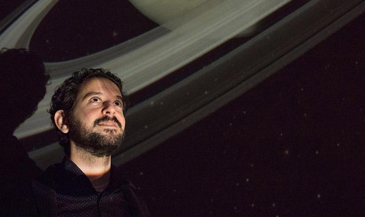 Astrophysicist Matt Russo makes music using the movements of objects in space. The music was featured in Our Musical Universe, an audio-focused planetarium show that debuted at U of T in January (photo by Romi Levine)