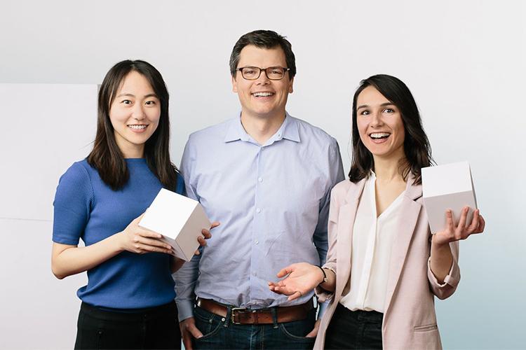 Livia Guo, Keith Pardee and Seray Cicek laugh together.