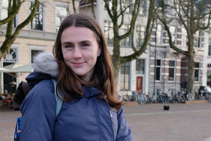 Vanessa Rezai-Stevens smiles, standing on an empty street outside a building.