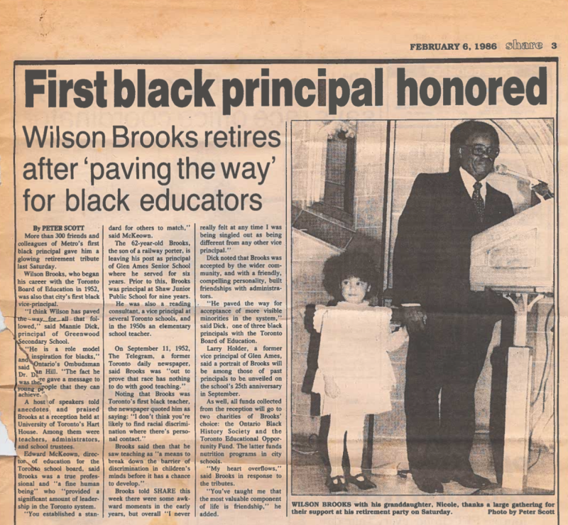 A photo of a newspaper clipping with the headline First black principal honored