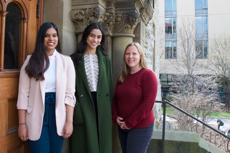 Kassandra Neranjan, Sakshi Shetty and Emily Hertzman smile while standing outside University College.