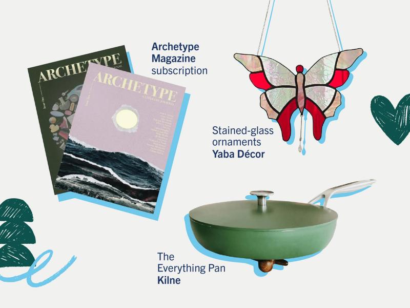 two issues of archetype magazine, a hanging stained-glass butterfly ornament, a green non-stick pan