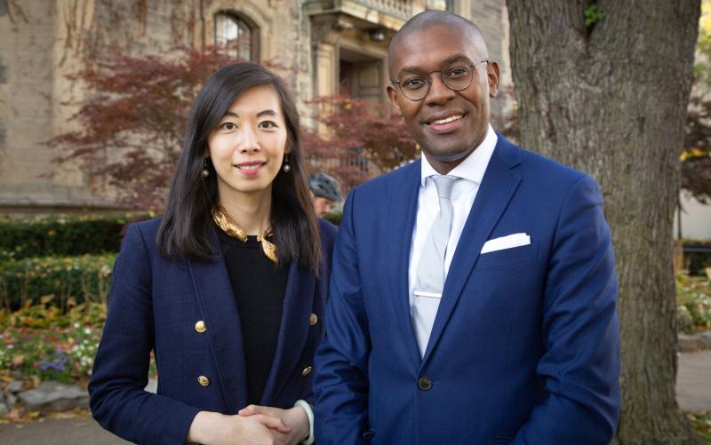 Stephanie Zhou and Colin Lynch stand outdoors, smiling.