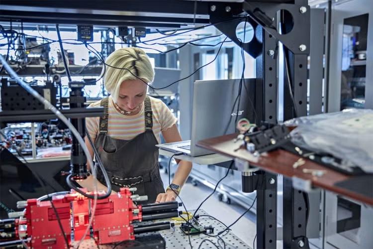 A person working in a robotics lab