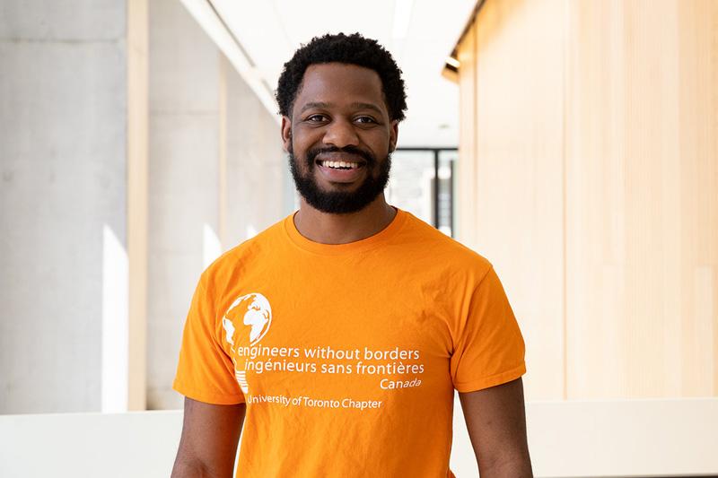 David Boroto smiling, and wearing an Engineers Without Borders T-shirt.