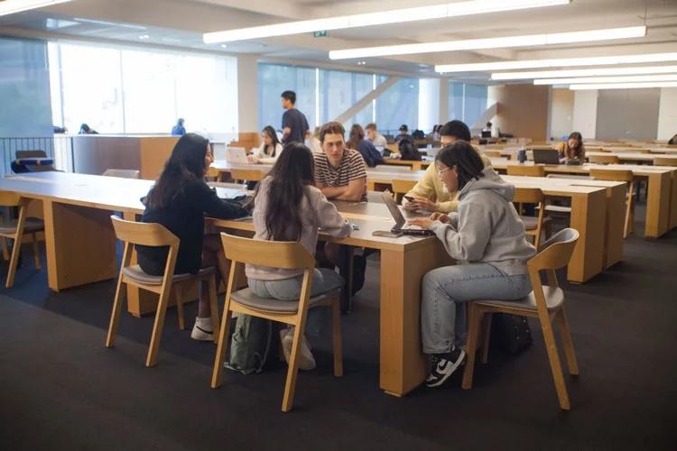Students sitting around a table studying