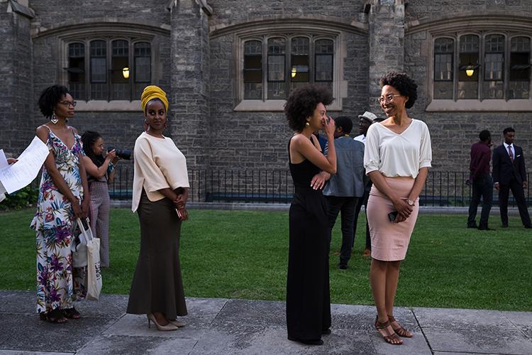 Students line up alphabetically before making their grand entrance at Hart House. 