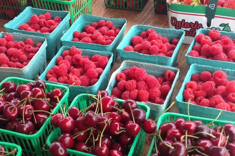 A tray of raspberries at the market. (Photo via U of T Scarborough Farmers' Market on Facebook)
