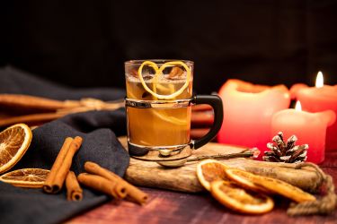 A Table with Drink, Spices and Candles