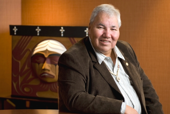 Senator Murray Sinclair is seated in front of the TRC Bentwood Box, carved by Coast Salish artist Luke Marston (photo courtesy of University of Manitoba) 
