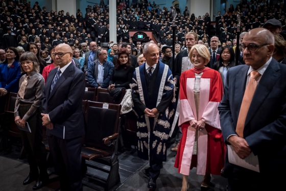 Rose Patten enters Convocation Hall with U of T President Gertler in advance of the robing ceremony. Her husband Tom Di Giacomo is second from the left (photo by Lisa Sakulensky) 