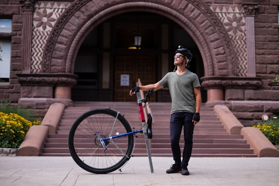 Taylor Stark, a U of T alumnus who is returning for a master's degree in classics, rode his unicycle "Caroline" from Vancouver to Toronto (photo by Geoffrey Vendeville) 