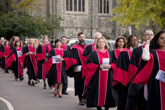 Alumni queue up in their robes to convocate