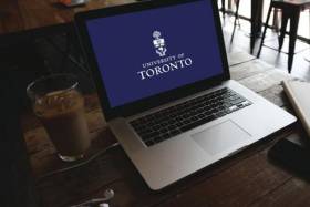Computer with U of T Logo.
