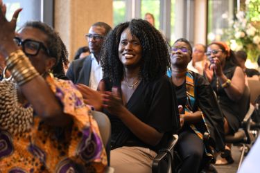 Image of women clapping. 