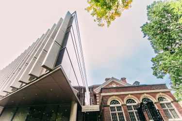 Photo of the front of Jackman Law and Flavelle House looking up towards the sky