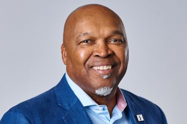 Portrait of Ray Williams, smiling at the camera