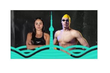 Two swimmers standing together. 