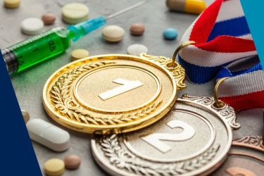Image of an injection, pills and gold, silver and bronze medals