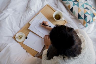 person studying on their room.
