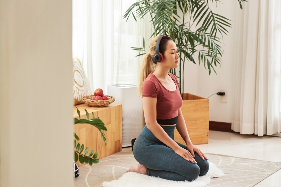 Woman meditating with an app
