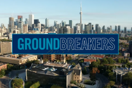 View of Toronto from the air with title shown of GROUNDBREAKERS.