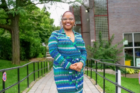 A portrait of Jacqui standing outdoors