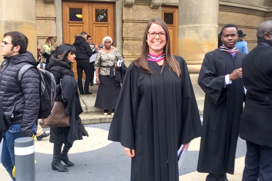 Erica Gavel smiles broadly as she stands among the swirling crowd on the steps of Convocation Hall.