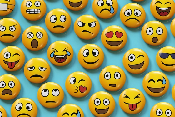 An array of emojis show faces smiling, frowning, winking, sweating, angry, with hearts for eyes, etc.