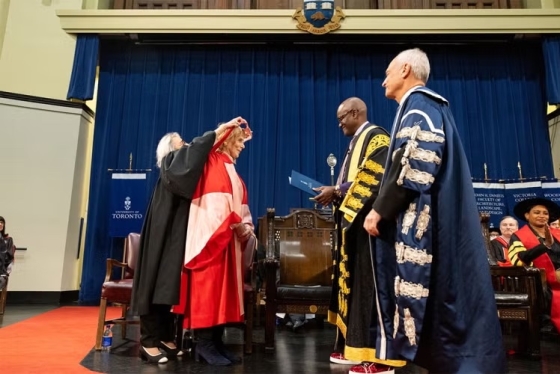 Jane Corkin on stage at a convocation ceremony