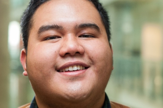 A portrait of LJ smiling