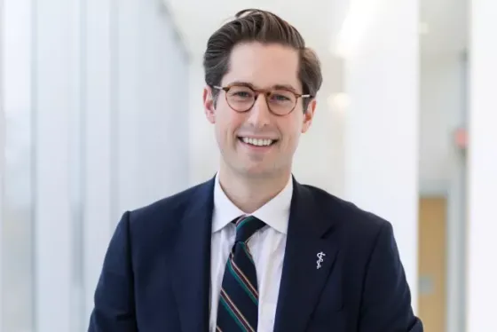 A portrait of Dr. Nowak wearing a suit and smiling